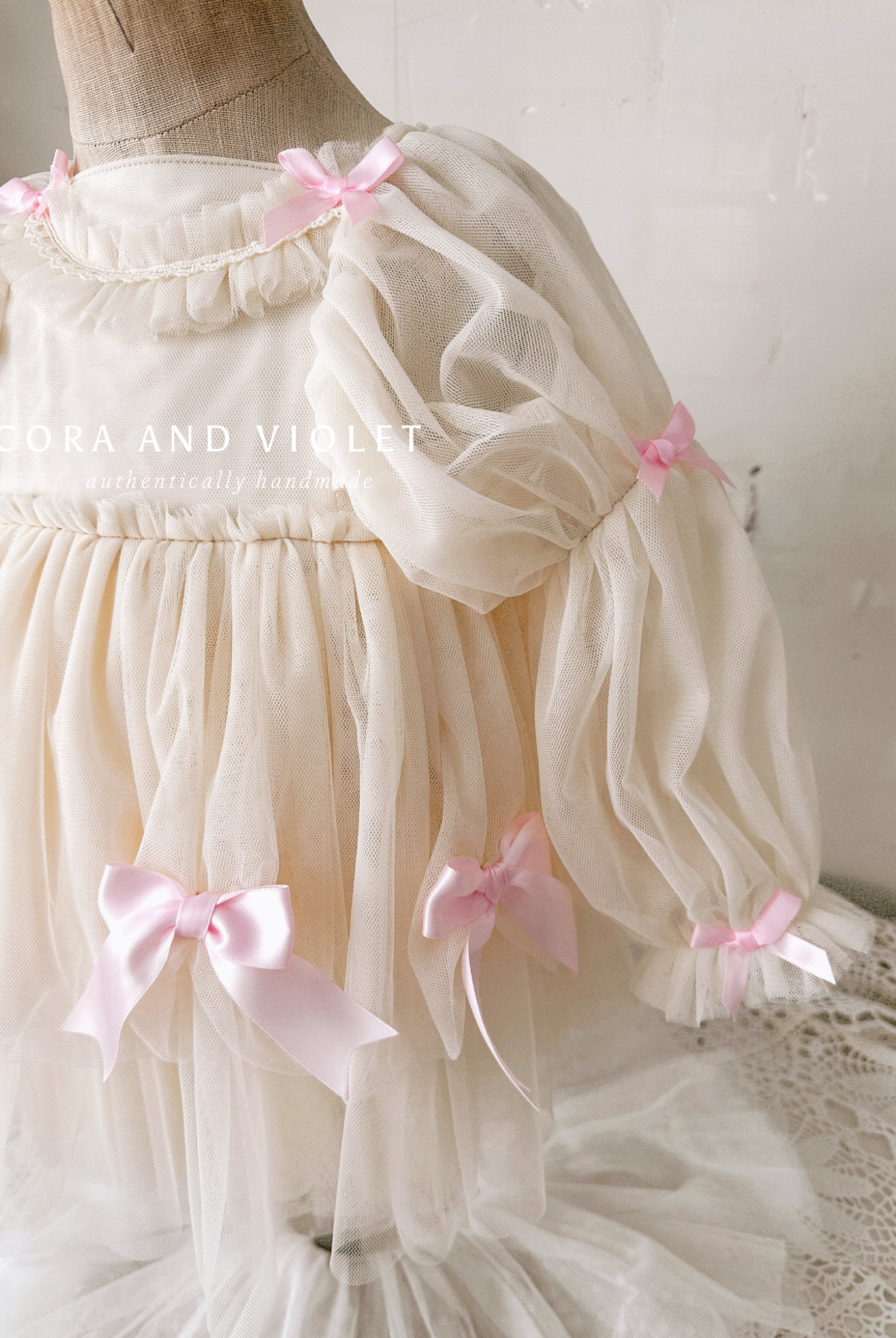 Hand-stitched luxury Silly Goose birthday dress for toddlers, featuring artisanal embroidery and heirloom construction by Cora and Violet.