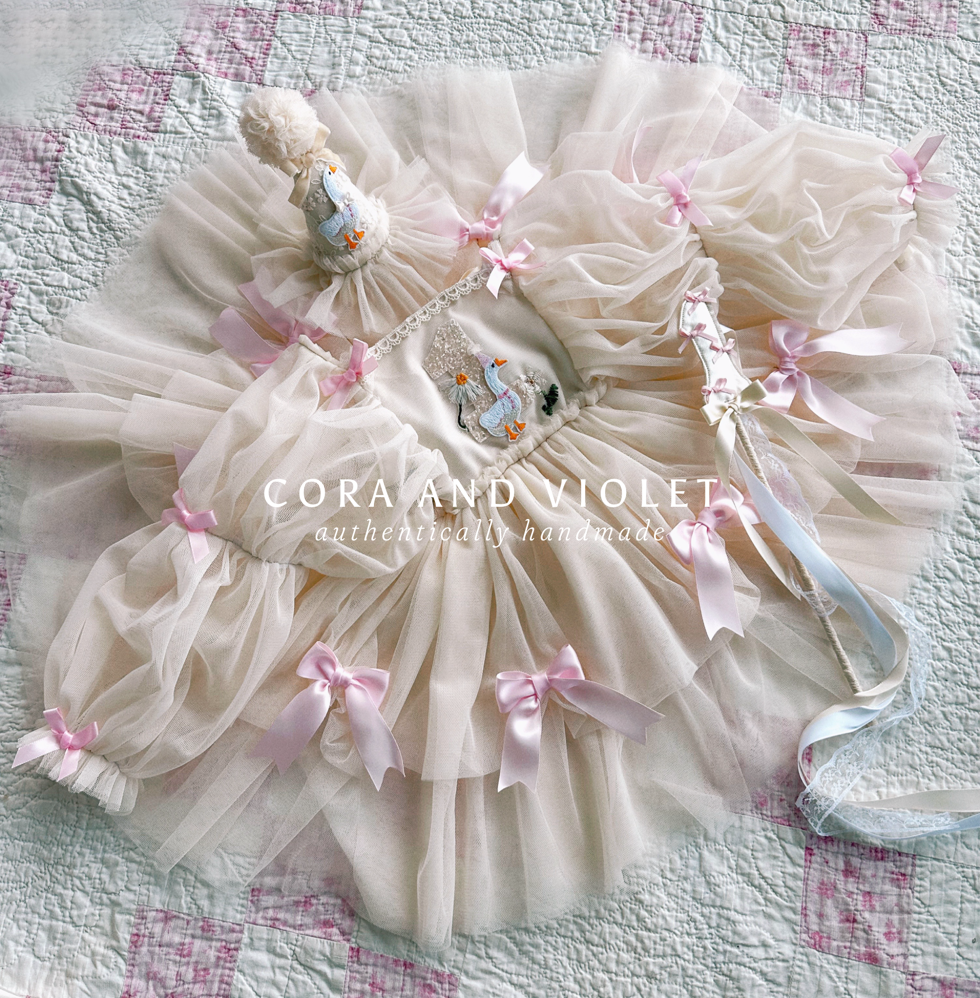 Hand-stitched luxury Silly Goose birthday dress for toddlers, featuring artisanal embroidery and heirloom construction by Cora and Violet.