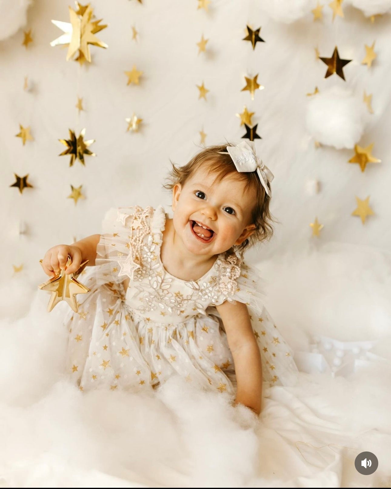 Child in a star-themed room with gold stars on a white background