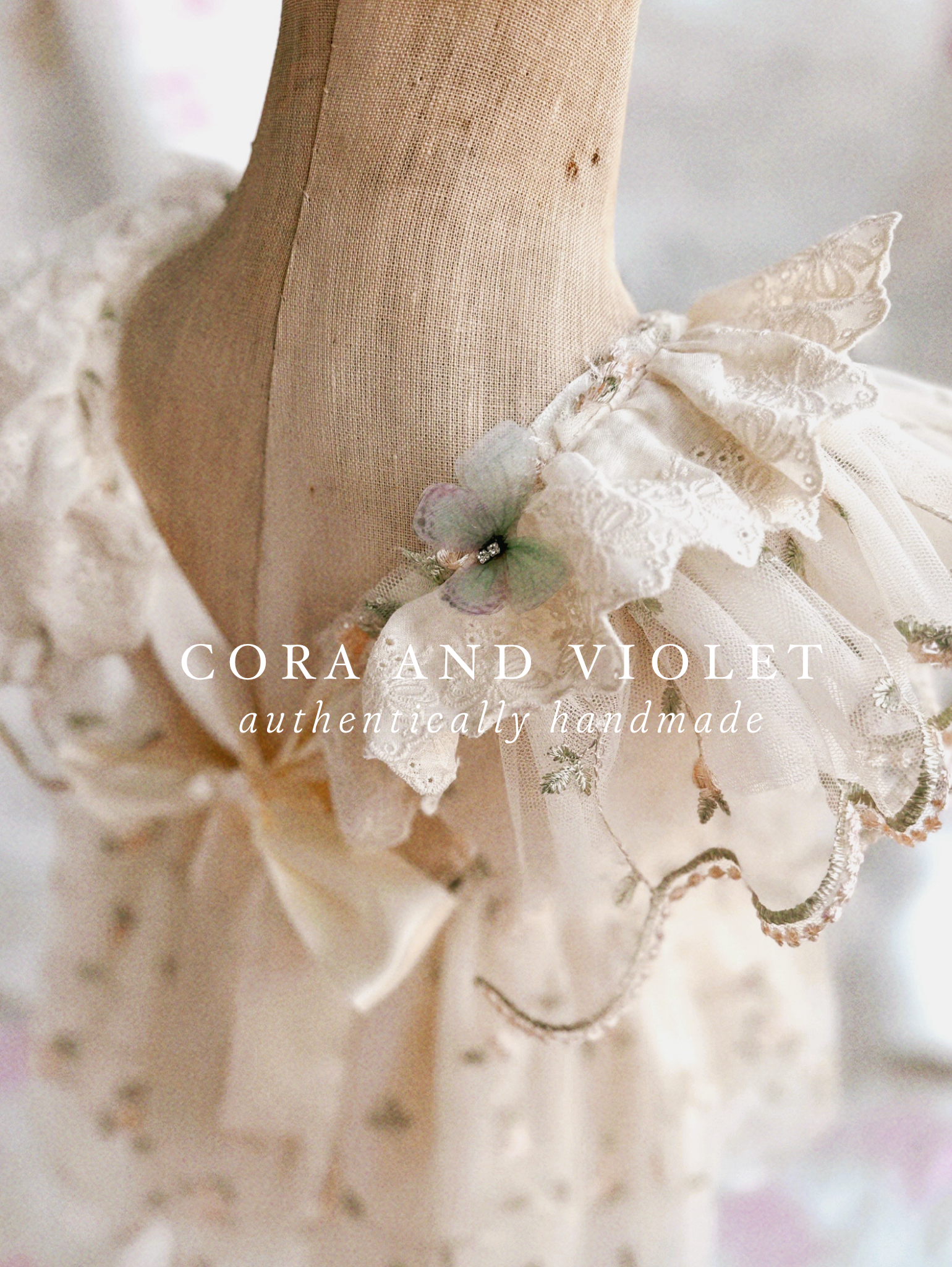 Rear view of the Winnie Heirloom dress showing adjustable straps and flexible waist for a long-lasting heirloom fit. 3d butterfly details handmade baby first birthday dress