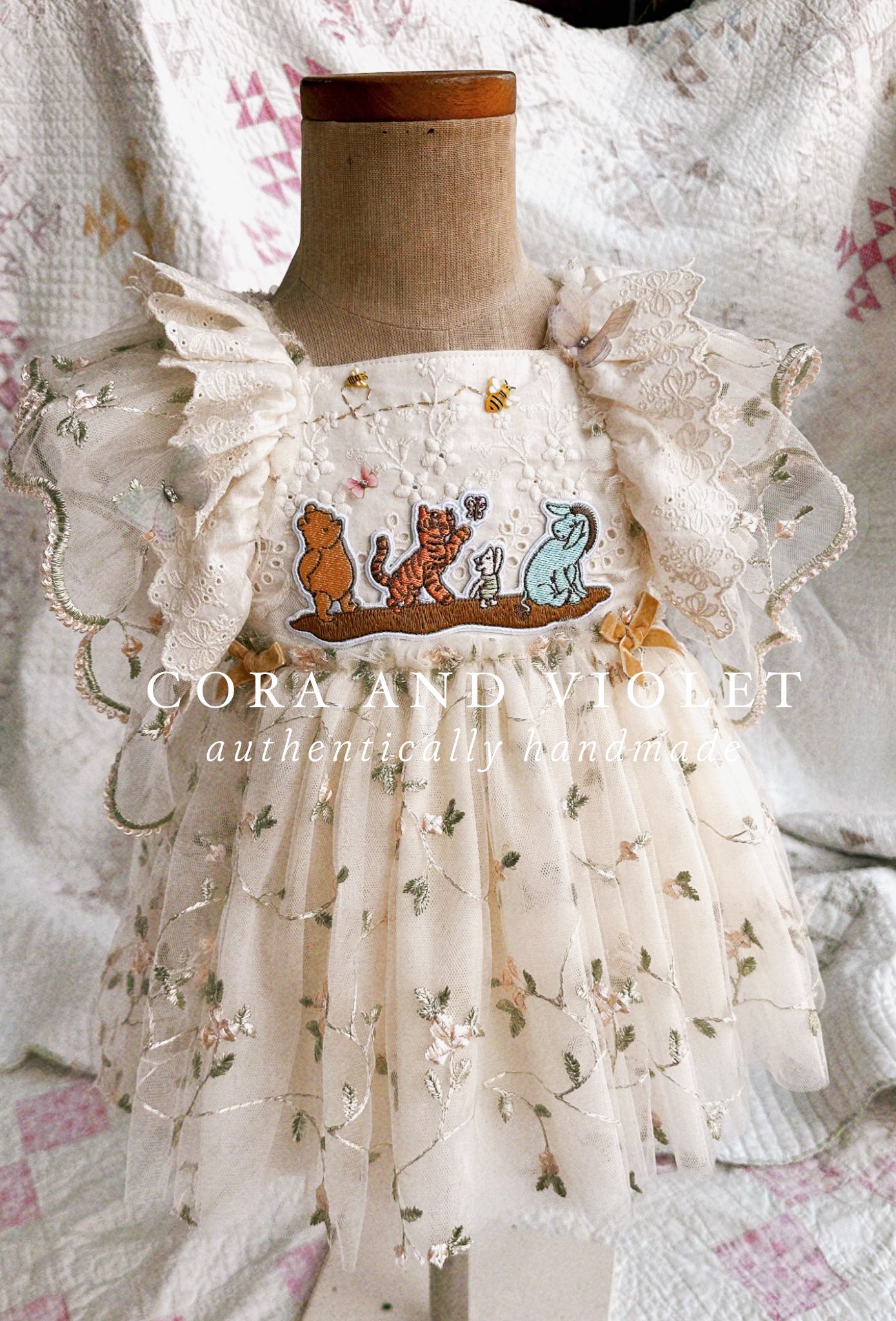 Rear view of the Winnie Heirloom dress showing adjustable straps and flexible waist for a long-lasting heirloom fit. mannequin fit adjustable shown size