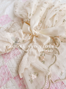 Rear view of the Winnie Heirloom dress showing adjustable straps and flexible waist for a long-lasting heirloom fit.