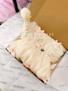 Hand-stitched luxury Silly Goose birthday dress for toddlers, featuring artisanal embroidery and heirloom construction by Cora and Violet.