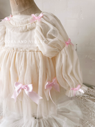 Hand-stitched luxury Silly Goose birthday dress for toddlers, featuring artisanal embroidery and heirloom construction by Cora and Violet.