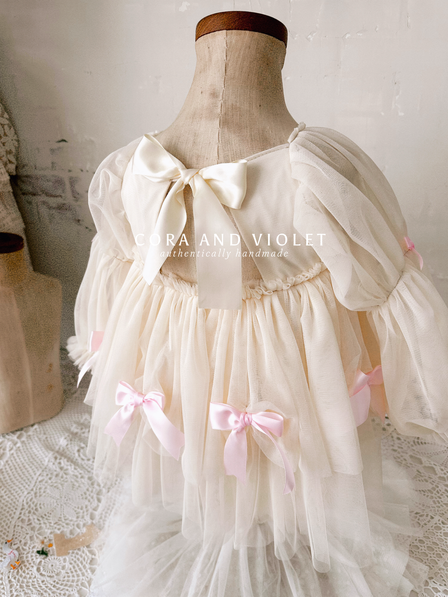 Hand-stitched luxury Silly Goose birthday dress for toddlers, featuring artisanal embroidery and heirloom construction by Cora and Violet.