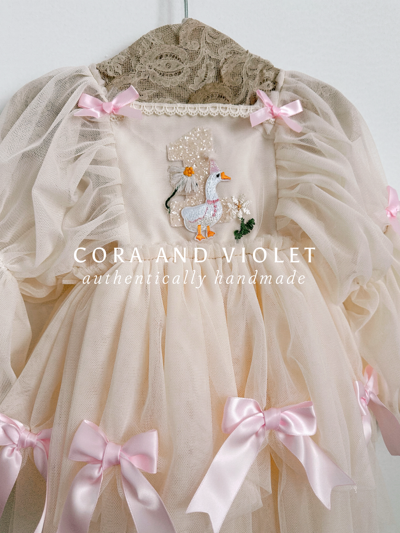 Hand-stitched luxury Silly Goose birthday dress for toddlers, featuring artisanal embroidery and heirloom construction by Cora and Violet.