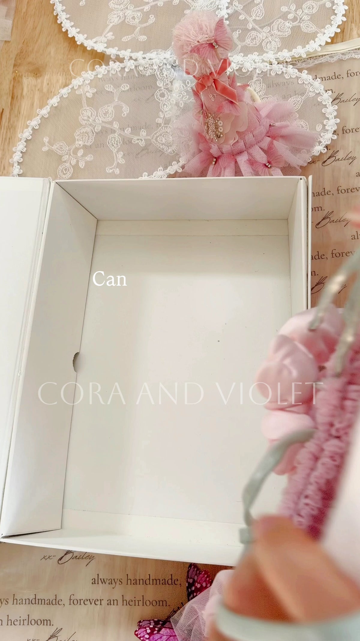 Packing an Ophelia Rose wildflower dress by hand in the Cora and Violet studio